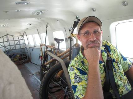 Chuck on the plane headed back to Kinshasa with a just completed transport bike ready to be taken to other parts of Congo for demonstration.